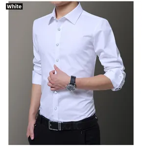 Detail of white slim-fit business shirt showing sharp collar and blue contrast buttons