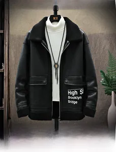 Detail of black faux leather winter jacket with sheepskin lining and high street letter print