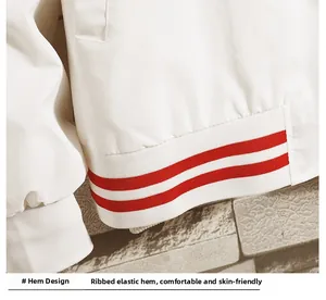 Close-up of white baseball jacket featuring red and white striped ribbed elastic hem details