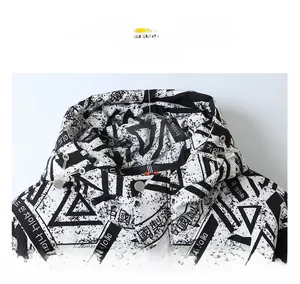 Detailed macro view of black and white geometric print and drawstring on hooded jacket