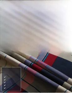 Detailed macro view showing the soft, non-pilling texture of red and blue plaid shirt fabric