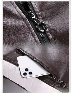 Detail of smooth metal zipper and secure side pocket on brown leather jacket