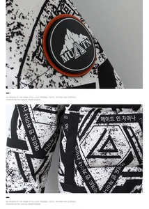 Close-up of MUATN rubber badge and black and white geometric pattern on down jacket arm