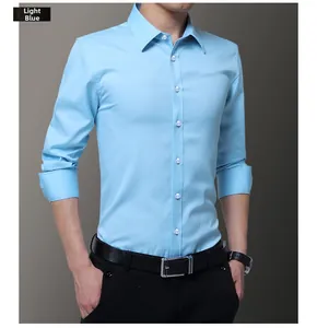 Detail of light blue slim fit men's shirt with premium fabric and classic collar