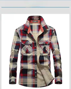 Detail of red and blue plaid shirt featuring dual chest pockets and fashion embroidery