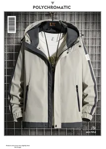 Detail view of men's hooded jacket featuring grey patchwork design and adjustable drawstring