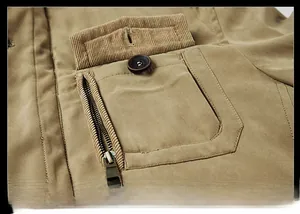 Detail of khaki men cotton jacket showing the chest flap pocket and metal zipper closure