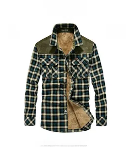 Detail of green plaid flannel shirt with warm faux fur lining and corduroy collar accent