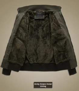 Detail of army green men's jacket showing thick dark fleece lining and ribbed cuffs