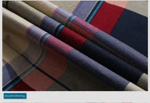Detail of red and navy plaid fabric showing neat stitching and tight weave texture