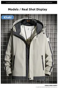Detail view of khaki hooded utility jacket with contrast panels and functional zipper pocket