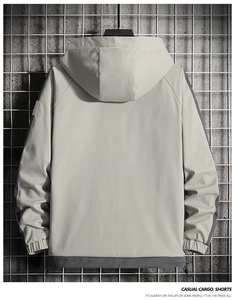 Detail view of hooded jacket back featuring grey splicing and adjustable drawstring hem