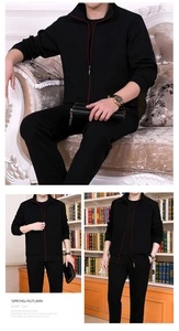 Detail of black sports suit featuring stand-up collar with red contrast zipper accents