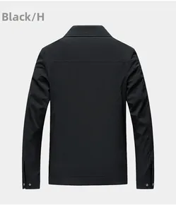 Detail view of the black jacket back showing polyester fabric and horizontal stitch line