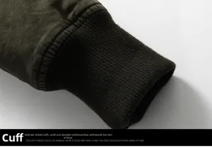 Detail view of military green jacket with thick ribbed cuffs for wind protection