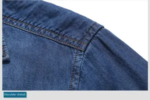 Detail of shoulder seam with yellow double-row stitching on dark blue denim shirt