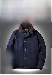 Close-up of warm brown sherpa lining and zip closure on navy workwear jacket