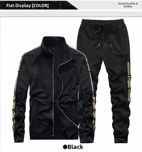 Detail of black sports jacket with gold freedom letter stripes and ribbed cuffs