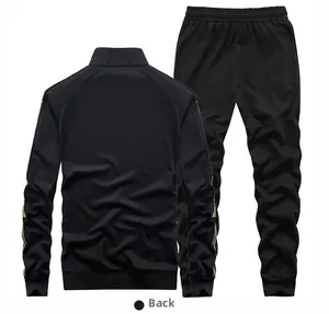 Rear view of black sports suit with gold side stripes on jacket and trousers