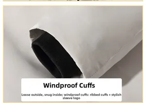 Détail d'une veste coupe-vent gris clair avec poignets élastiques pour la chaleur