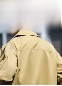 Detailed back view of khaki cotton canvas jacket showing stitching and turn-down collar