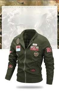 Detail of army green military jacket featuring vintage embroidered patches and ribbed cuffs