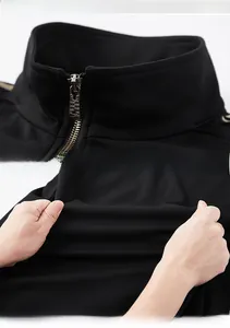 Detail view of black stand-collar men's sports jacket featuring high-stretch fabric