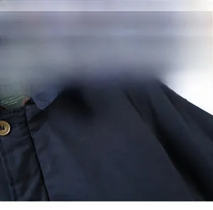 Detail of navy blue winter jacket featuring white ARMY print and fleece collar texture