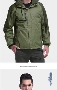 Detail of olive green waterproof outdoor jacket showing chest pocket and embroidery