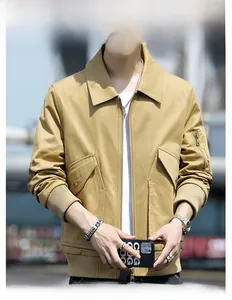 Close-up of khaki utility jacket showing ribbed cuffs and functional sleeve pockets