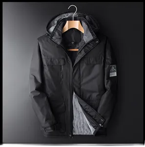 Detail of men's black hooded outdoor jacket featuring warm grey fleece lining