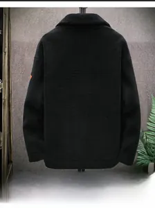 Detail view of the black lamb wool jacket's back showing warm textured fleece fabric