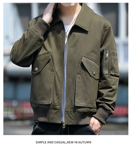 Detail view of military green bomber jacket featuring rib-knit cuffs and utility sleeve pocket