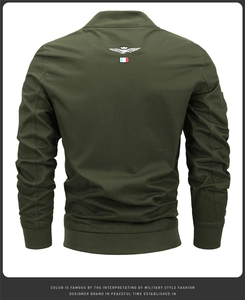 Detail view of military green jacket back featuring eagle embroidery and ribbed hem