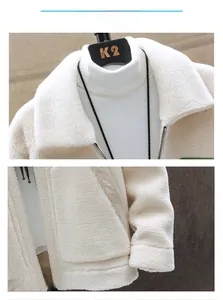 Detailed macro view of heavy fleece collar and metal zipper on white winter jacket