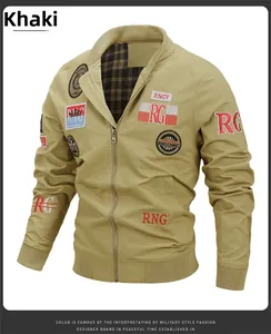 Detail of khaki military jacket featuring embroidery badges and classic plaid lining texture