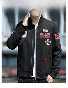 Detail of embroidered lettering and vintage metal zipper on black cotton jacket