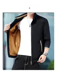 Men's winter jacket detail featuring thermal fleece lining and striped rib-knit stand collar
