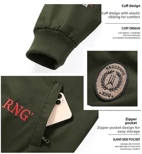 Detail of military green jacket featuring ribbed cuffs and embroidered zipper pockets