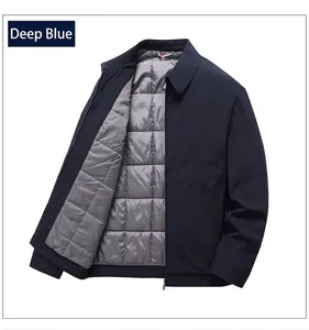 Detail view of navy blue winter jacket featuring grey quilted lining and iconic collar trim
