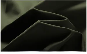 Close-up detail of dark olive green twill cotton fabric with high density texture