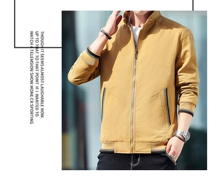 Detail of khaki men's stand collar jacket featuring striped ribbed cuffs and hem