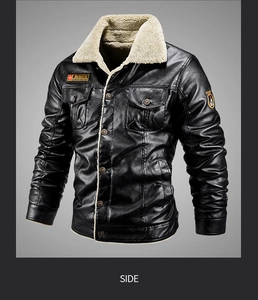 Detail of vintage black PU leather jacket with beige lamb wool collar and badge patches