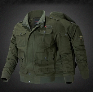 Detail of army green military jacket featuring four large flap pockets and shoulder epaulettes