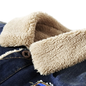 Men's dark blue denim jacket with beige sherpa lining and metal buttons detail