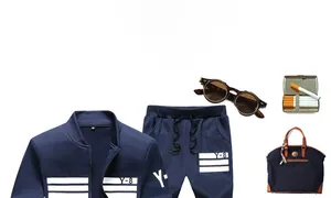 Detail of navy track suit jacket and shorts with Y-8 logo and white athletic stripes