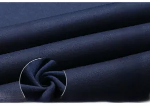 Detailed view of dark blue knit fabric with grey ribbed collar and Y-8 printed logo