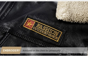 Macro detail of PU leather jacket featuring faux fur collar and star embroidery badge