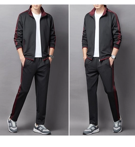 Detail of men's two-piece sports tracksuit with red and grey zip jacket and joggers