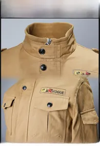 Detail of khaki military jacket with stand collar and embroidered A VOGUE chest pocket